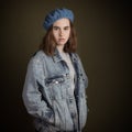 Brunette Teenage Girl Wearing Blue French Wool Barret and Denim Royalty Free Stock Photo