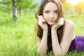 Brunette teenager girl lying on meadow Royalty Free Stock Photo