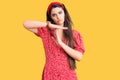 Brunette teenager girl wearing summer dress doing time out gesture with hands, frustrated and serious face Royalty Free Stock Photo