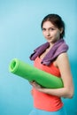 Brunette with twisted fitness mat