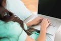 Brunette using her laptop on sofa Royalty Free Stock Photo
