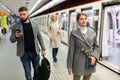 Brunette waiting for train on underground station