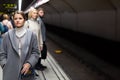 Brunette waiting for train on underground station