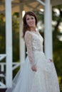 Brunette in a white dress in the park Royalty Free Stock Photo