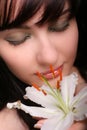 Brunette with white lily flowers Royalty Free Stock Photo