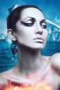 Brunette winter woman in flame with diamond earring