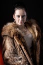 Portrait of beauty woman in luxury winter fur coat Royalty Free Stock Photo