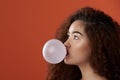 Brunette woman blow bubble gum ball Royalty Free Stock Photo