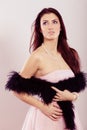 Brunette woman in bright dress boa feather Royalty Free Stock Photo