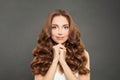 Brunette woman with clean skin and long shiny curly hair. Beautiful fashion model with wavy hairstyle. Care and beauty concept Royalty Free Stock Photo