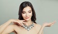 Brunette woman fashion model in diamond jewelry necklace Royalty Free Stock Photo