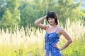 Brunette woman in field