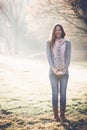 Brunette woman holding DIY Christmas tree decoration