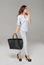 Brunette woman with large bag Royalty Free Stock Photo