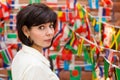 Brunette woman looking over her shoulder back against Royalty Free Stock Photo