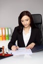 Brunette woman notary public notarizes the contract Royalty Free Stock Photo