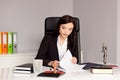 Brunette woman Notary Public reading and signing testament Royalty Free Stock Photo