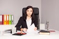 Brunette woman Notary Public signing testament. Royalty Free Stock Photo