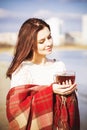 Brunette woman outdoors in check pattern plaid smiling Royalty Free Stock Photo