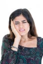 Brunette woman in pain having headache hand on head on white background