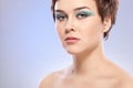 Brunette woman portrait with blue makeup Royalty Free Stock Photo