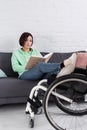 Brunette woman reading book while sitting Royalty Free Stock Photo