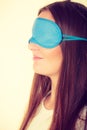 Brunette woman sleeping in blue eye sleep mask Royalty Free Stock Photo