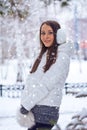 Brunette woman standing in winter park Royalty Free Stock Photo