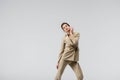 brunette woman in stylish pantsuit touching Royalty Free Stock Photo