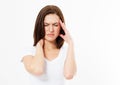 Brunette Woman suffering from stress or headache grimacing in pain as she holds the back her neck with her other hand Royalty Free Stock Photo