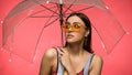 Brunette woman in swimsuit holding umbrella Royalty Free Stock Photo