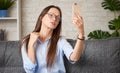 Brunette woman is taking selfie on her smartphone Royalty Free Stock Photo