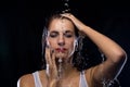Brunette woman under running water Royalty Free Stock Photo