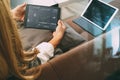 brunette woman using digital talet and laptop computer on sofa i Royalty Free Stock Photo