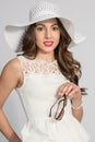 Brunette Woman in White Hat Royalty Free Stock Photo