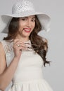 Brunette Woman in White Hat Royalty Free Stock Photo