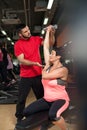 Brunette woman working out with personal trainer Royalty Free Stock Photo