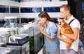 Woman and boy with interest looking at small aquarium Royalty Free Stock Photo