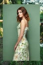 Brunette young woman in floral spring summer dress Royalty Free Stock Photo