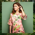 Brunette young woman in floral spring summer dress Royalty Free Stock Photo