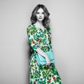 Brunette young woman in floral spring summer dress Royalty Free Stock Photo