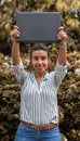 Brunette young women holding over her head a laptop with copy space for a logo Royalty Free Stock Photo