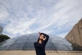 Brunetter girl next to a modern building Royalty Free Stock Photo