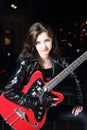 Brunettte guitar player girl Royalty Free Stock Photo