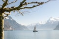 Small boat sailing on Lake Lucerne near Brunnen in Switzerland