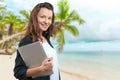 Brunnete woman holding laptop