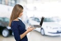 Brunnete woman holding laptop