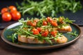 bruschetta with baby arugula, cherry tomatoes on ceramic plate