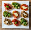 Bruschetta with beans and arugula, mushrooms, goat cheese