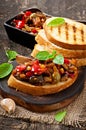 Bruschetta caponata with raisins and pine nuts Royalty Free Stock Photo